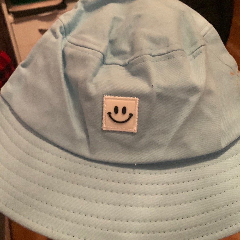 Smiley face blue bucket hat